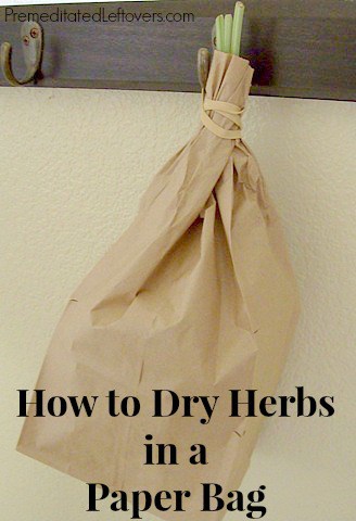 Drying herbs in a brown paper bag