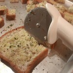 Using-a-pizza-Cutter-to-Quickly-Cut-Croutons