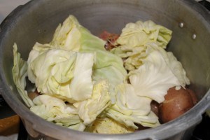 Add cabage to the corned beef in pressure cooker (640x427)