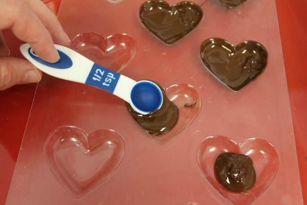 how to make heart truffles - coating molds with chocolate