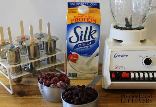 Ingredients to make mixed berry popsicles with Silk Vanilla Soymilk