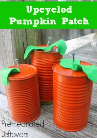 Rustic Tin Can Pumpkins - An Upcycled DIY Project - These easy tin can pumpkins are made with recycled tin cans, screws, and a little bit of spray paint.