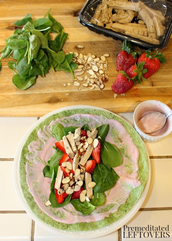 Making Strawberry, spinach and chicken wraps