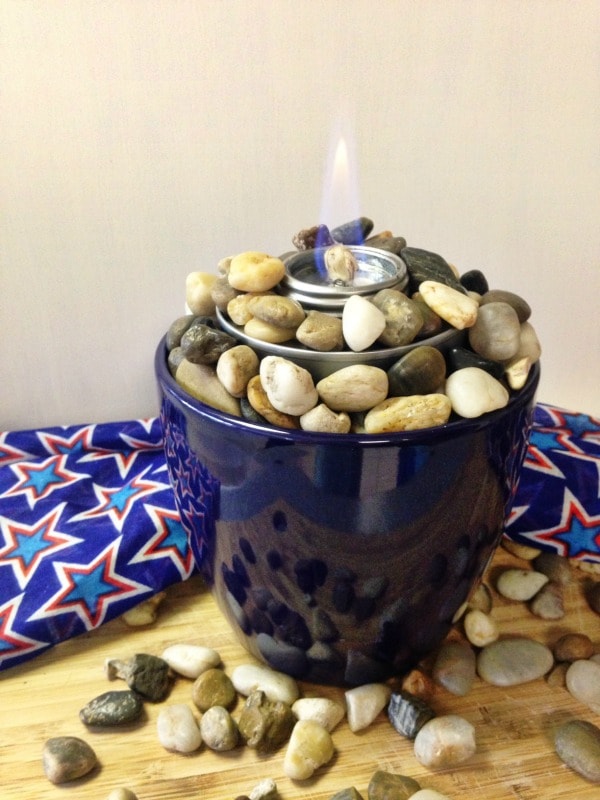 How to Make a Tabletop Fire Pit with a planter, rocks, and a chafing fuel cup. Use this easy tutorial to make a mini tabletop fire pit for summer parties.