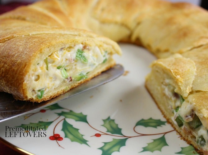 serving a piece of jalapeno popper crescent ring recipe
