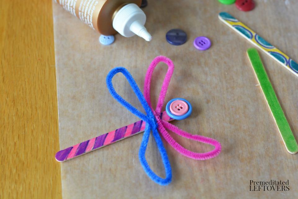 Popsicle Stick Dragonfly Craft with Buttons - glue buttons to popsicle stick