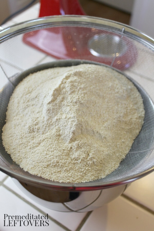 Sifting Homemade Quinoa Flour through a Sieve