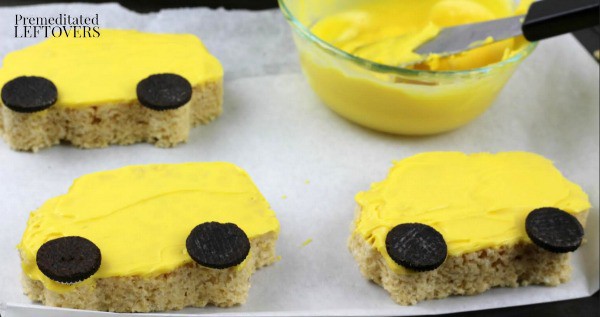 School Bus Rice Krispie Treats- cover evenly with chocolate and add cookie wheels