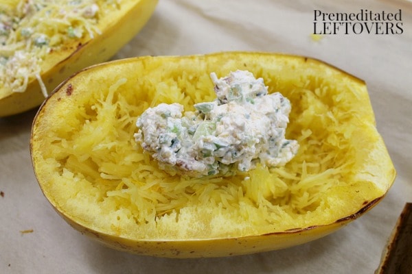 Add a scoop of the Jalapeno Popper mixture to the Cooked Spaghetti Squash