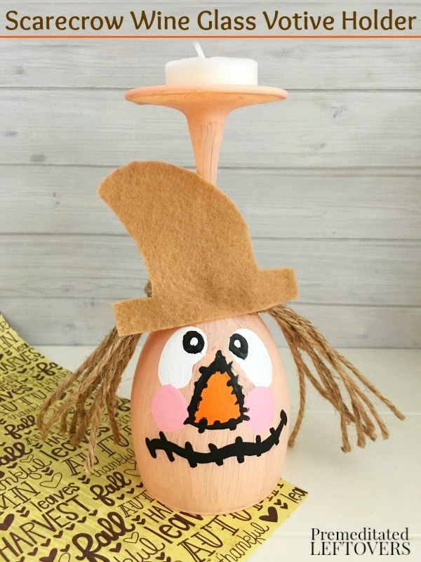 This DIY Scarecrow Wine Glass Votive Holder is a great fall craft. It's an inexpensive way to decorate your table with a pretty tea light candle.