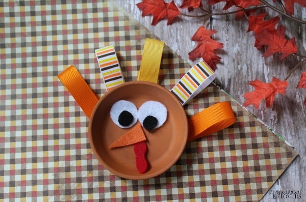 Reuse a terra cotta saucer to make this colorful Flower Pot Saucer Turkey Craft. It is an easy and frugal craft to make with kids this fall. 