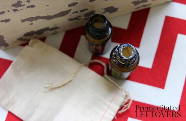 0 Recipes for Upcycling Your Essential Oil Bottles- glass essential oil bottles and linen sachet