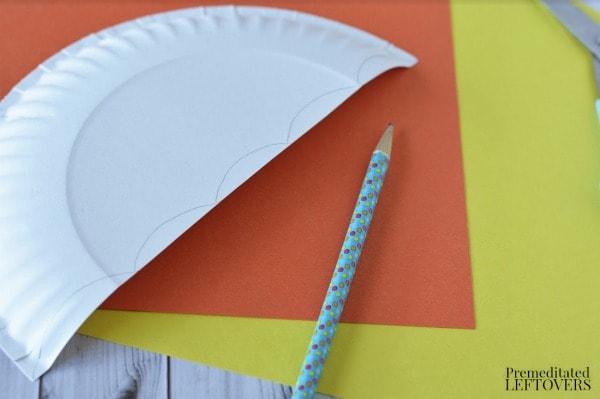 Paper Plate Umbrella- cut plate and draw scallop on edges