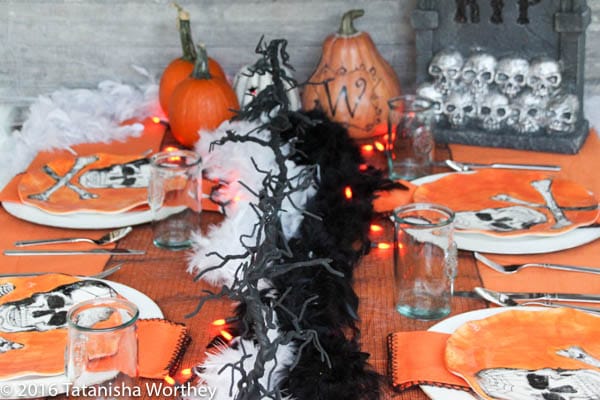 Orange and Black Skeleton Halloween Tablescape- decorated dinner table