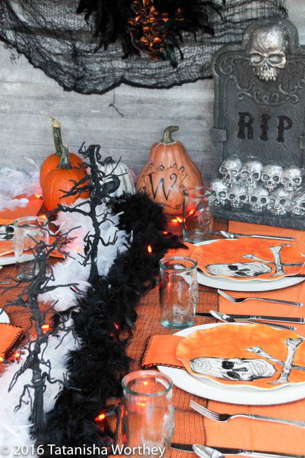Orange and Black Skeleton Halloween Tablescape- black and white boas on Halloween table