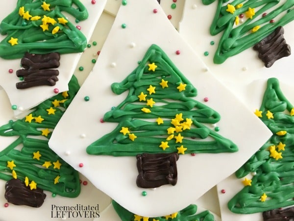 Making Christmas Tree Chocolate Bark is easily one of my favorite fun ways to celebrate the holiday season.  It breaks apart easily to create bite-sized chocolate bark treats that everyone will love seeing on your holiday dessert buffet!