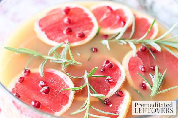 Grapefruit and Pomegranate Punch with Rosemary- punch bowl garnished with rosemary