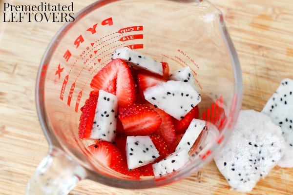 Strawberry Oatmeal Chocolate Smoothie- dragon fruit and strawberries in a measuring cup