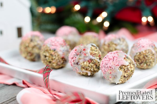 Now comes the fun part. The finished snack balls get dipped into melted white chocolate and sprinkled with crushed peppermint candy canes. If that doesn't put a smile on your mug then I don't think you're really in the holiday mood.