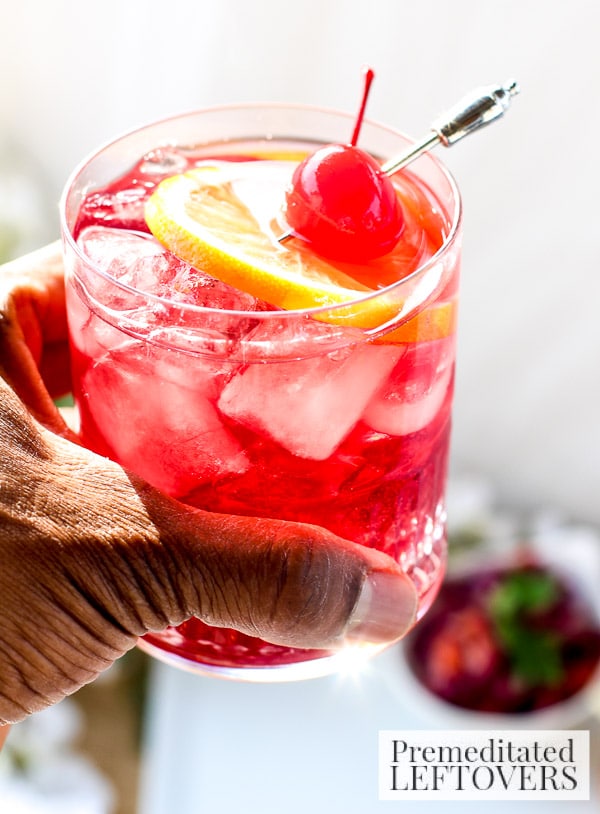 Beat the winter blahs with this Bourbon and Cherry Cocktail! It's a refreshing recipe with Bourbon, Maraschino cherries, and a splash of citrus.