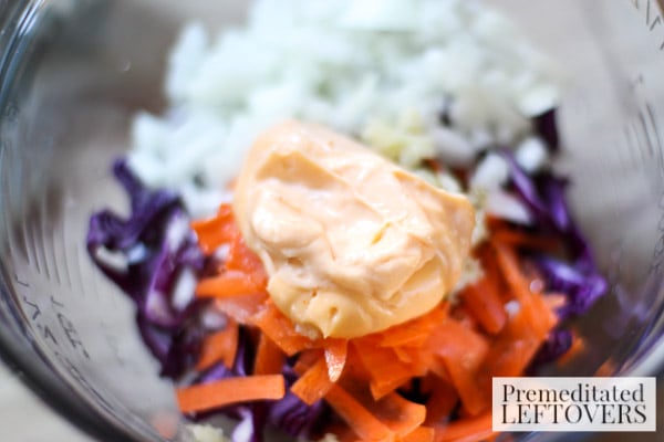 Red Cabbage Cole Slaw with Sriracha Mayo- mix ingredients in a bowl