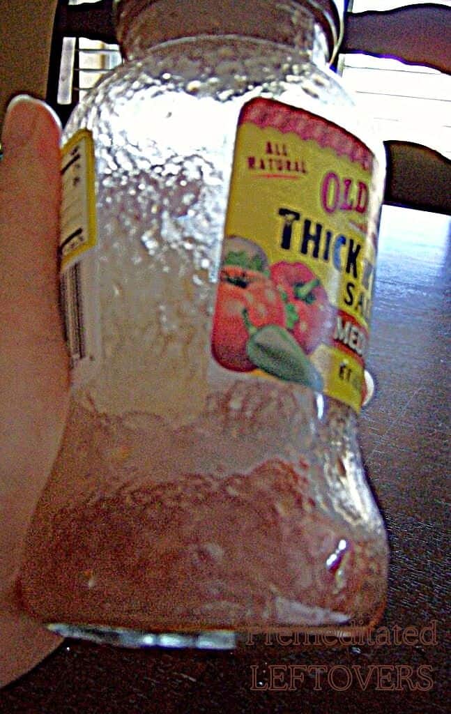 Last Dregs of Salsa in Jar Mixed With Water