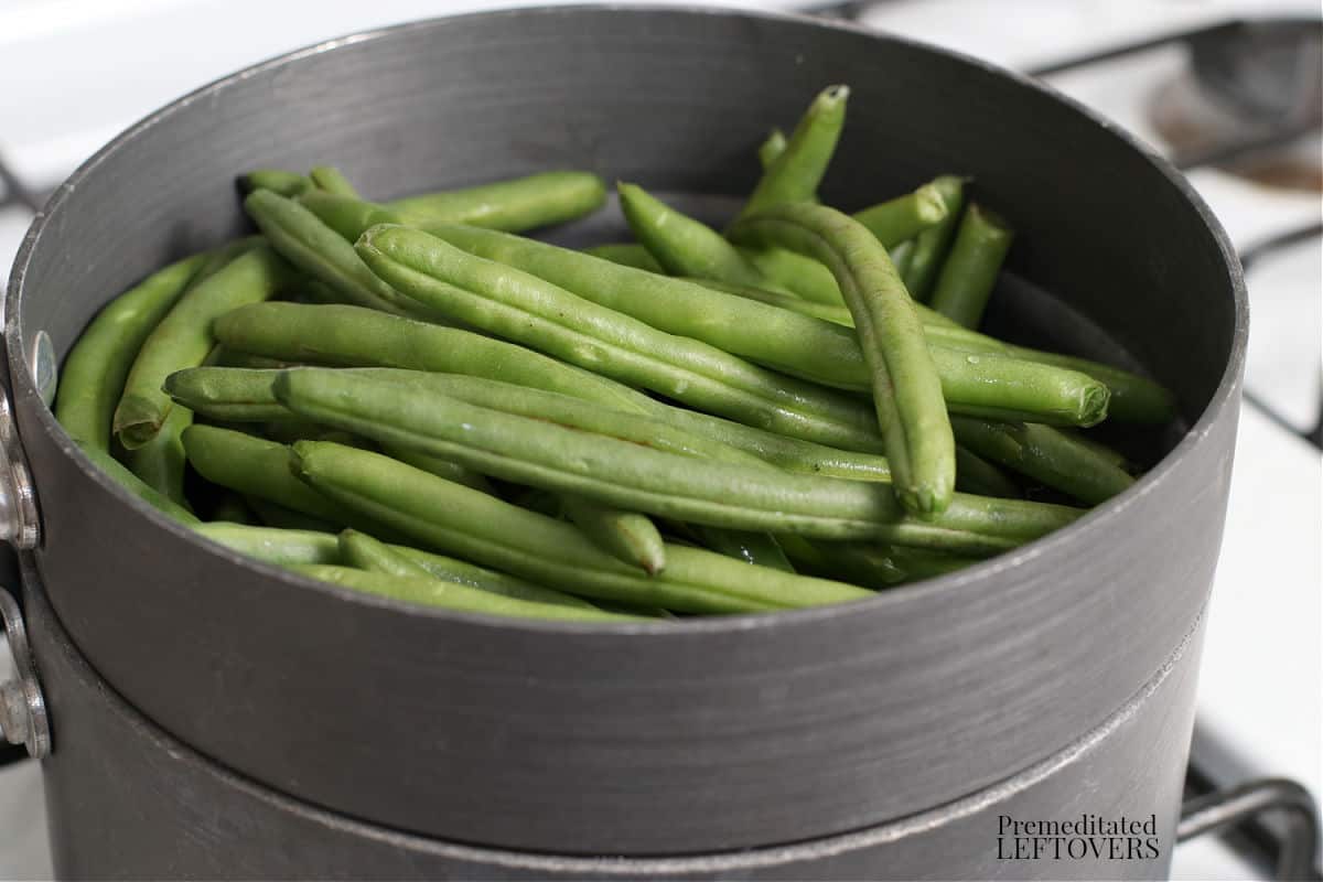 fresh green beans in a double boiler
