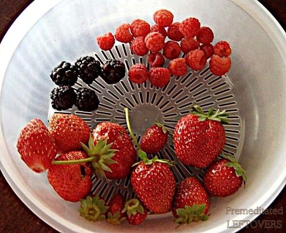 Fresh berries from the garden in a colander