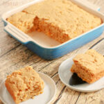 cornbread casserole recipe in baking dish and a slice of corn casserole on a plate