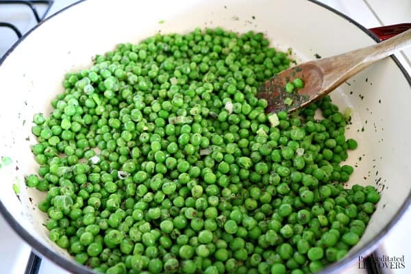 Add the peas, basil and parsley to the pan.