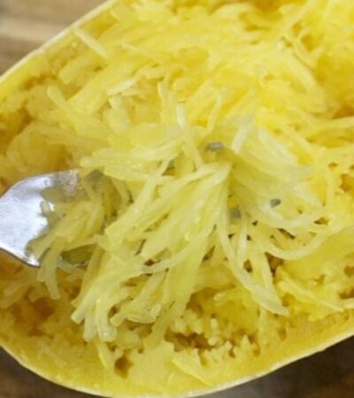 use a fork to break spaghetti squash flesh into spaghetti noodles