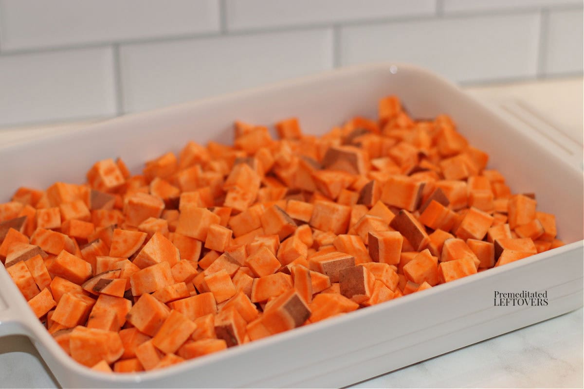 cut sweet potatoes pieces in casserole dish