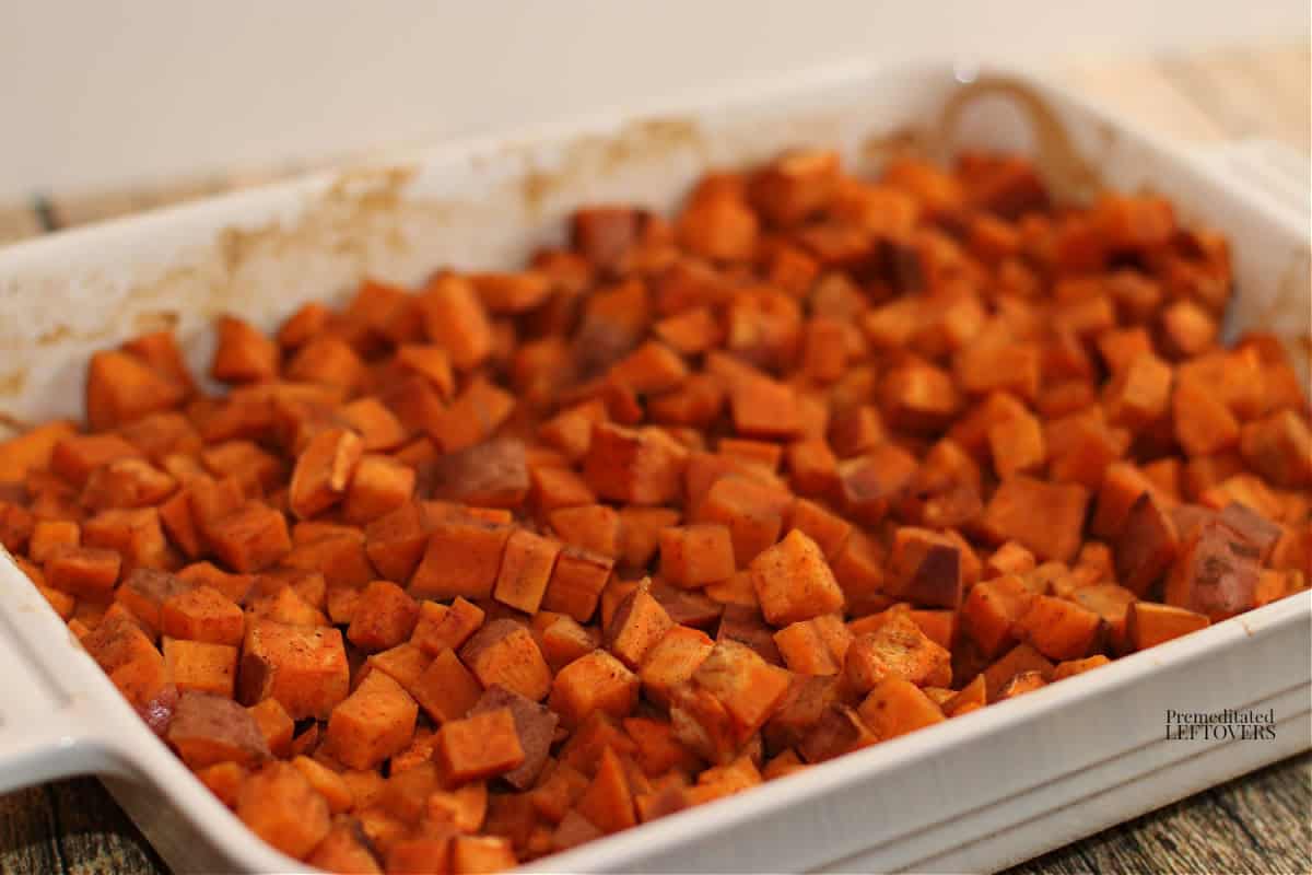 roast sweet potatoes recipe with chai spice in casserole dish