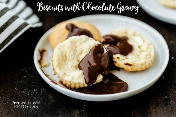 Biscuits with chocolate gravy on a white plate.