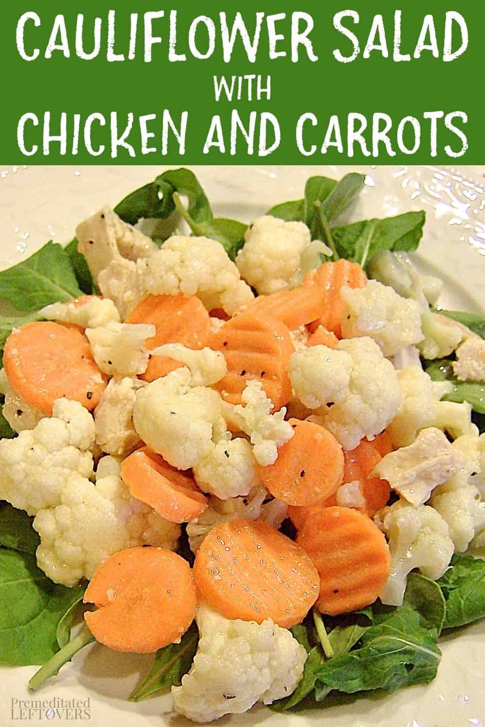 Cauliflower Salad with Chicken and Carrots on a plate, garnished with spinach leaves.