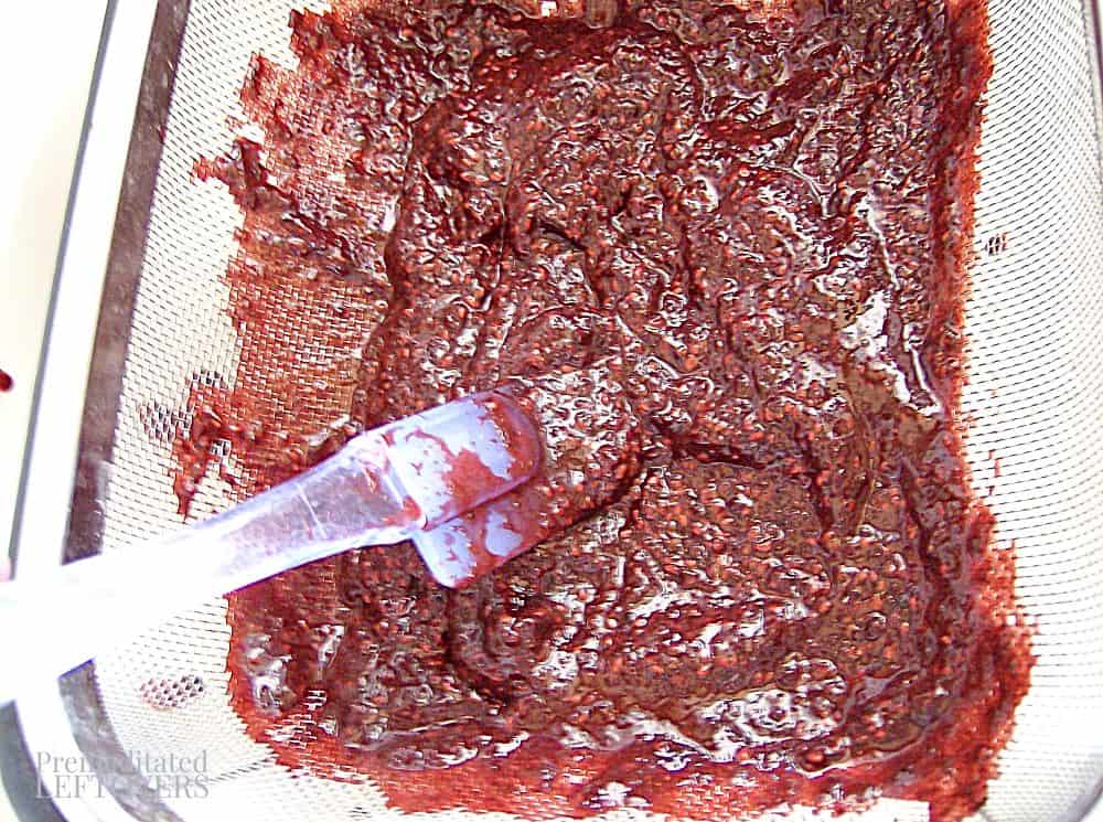 Removing seeds from the mixed berry sorbet