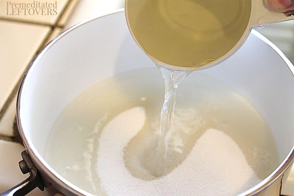 Pouring water into the sugar.