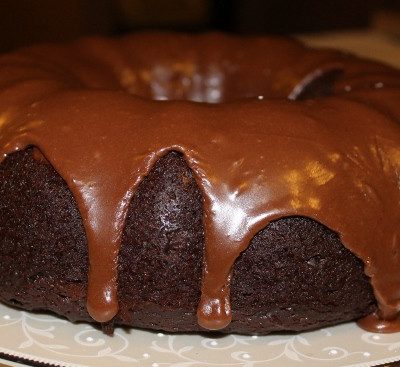 An easy recipe for Mocha Fudge Cake. Make it in a bundt cake pan and top it with Mocha Fudge glaze. Uses coffee instead of milk or water for the liquid.