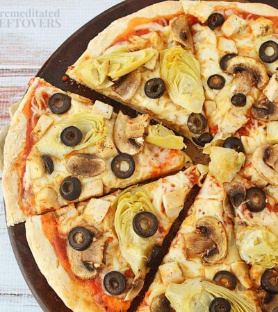 Chicken artichoke pizza sliced and ready to eat