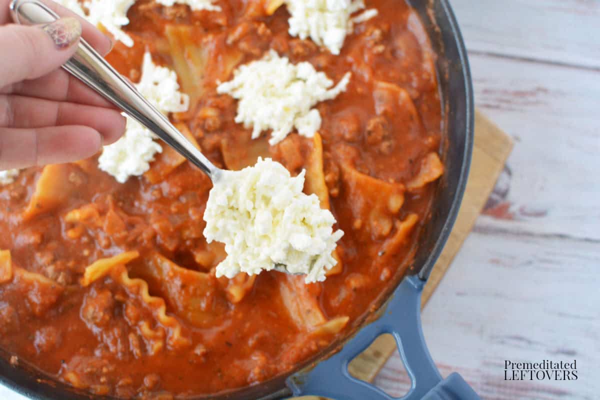 add dollops of the cheese mixture to the skillet lasagna