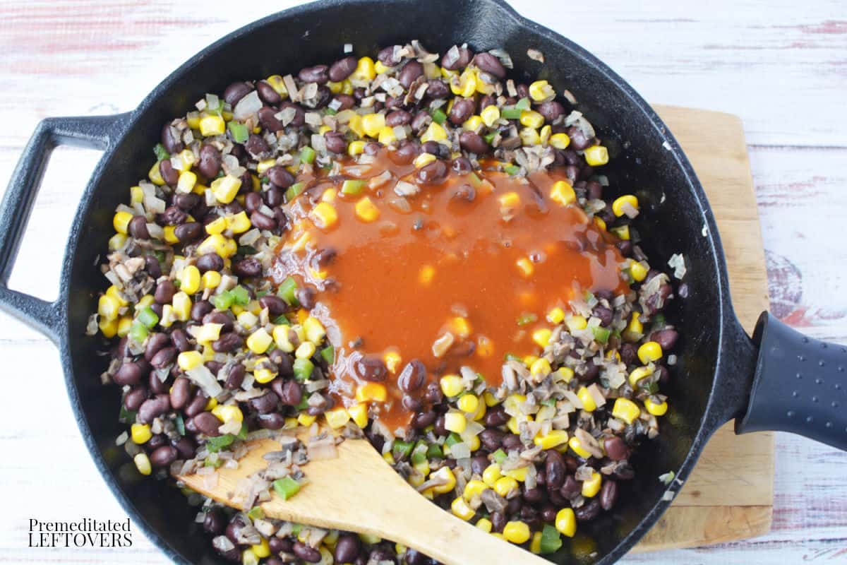 Add black beans, corn, and enchilada sauce to the mushroom mixture