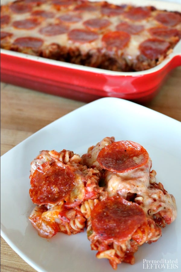 This quick and easy pizza casserole recipe is a favorite with kids! Use your favorite pizza toppings to make a pizza pasta bake. The recipe uses raw pasta and the noodles cook in the oven.