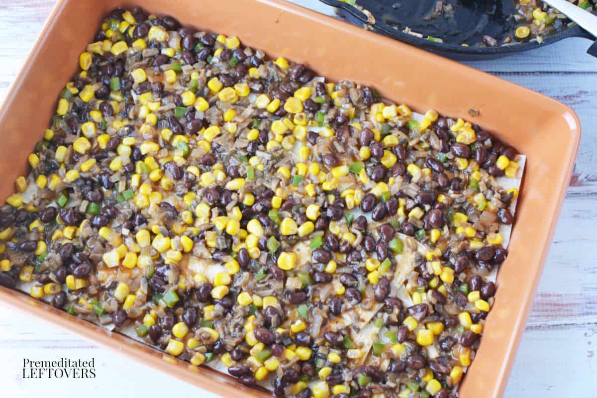 spread half of the mushroom and black bean mixture over the tortilla pieces