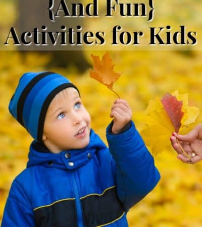 A child looking at a fall leaf - one of the education fall activities suggested.