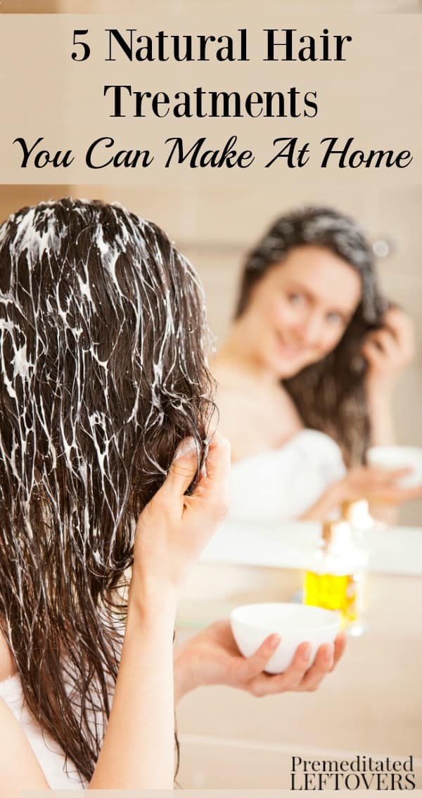 Woman applying natural hair treatment to her hair