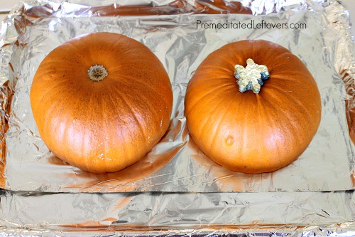 Place pumpkin halves cut side down on baking sheet.