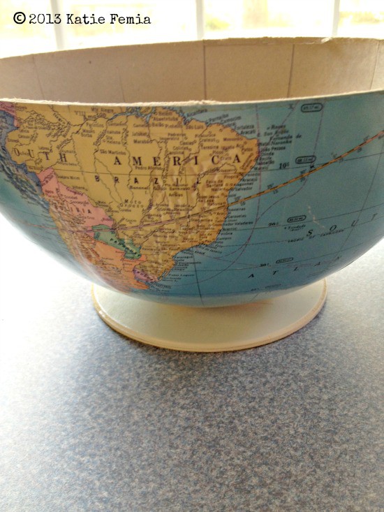 attach half the globe to the base to create a bowl