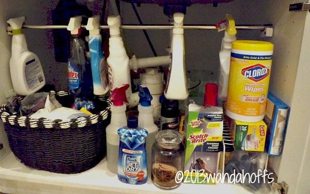 organization tip - use tension rod to hang cleaning product on