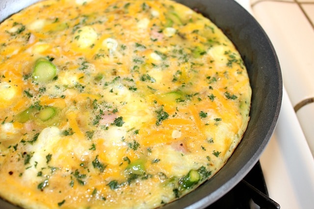 cook the frittata over a medium low flame until the egg mixture firms up on the bottom and edges