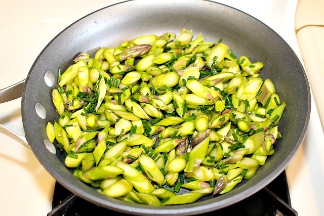 sauteing the asparagus and chives